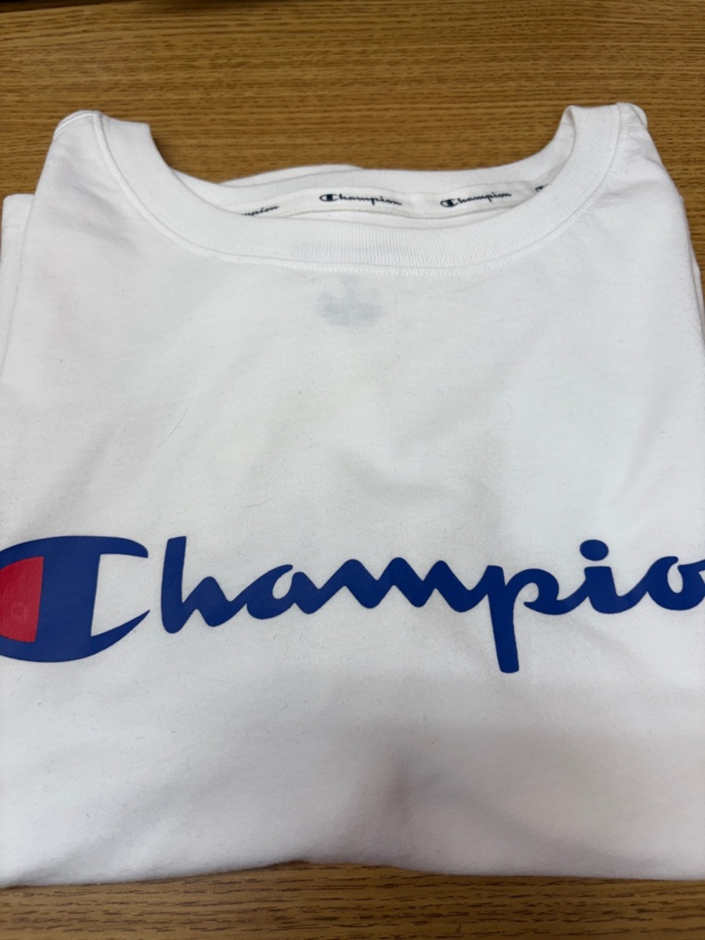 Woman’s Champion White Logo Crop Tee with Blue & Red Accent